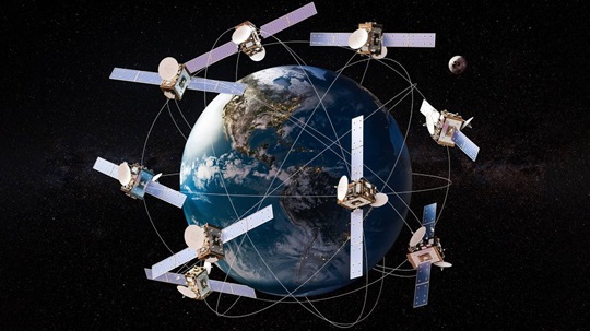 A digital illustration showing multiple satellites orbiting Earth, interconnected by lines to depict their trajectories, set against a backdrop of space with a distant view of the Moon.
