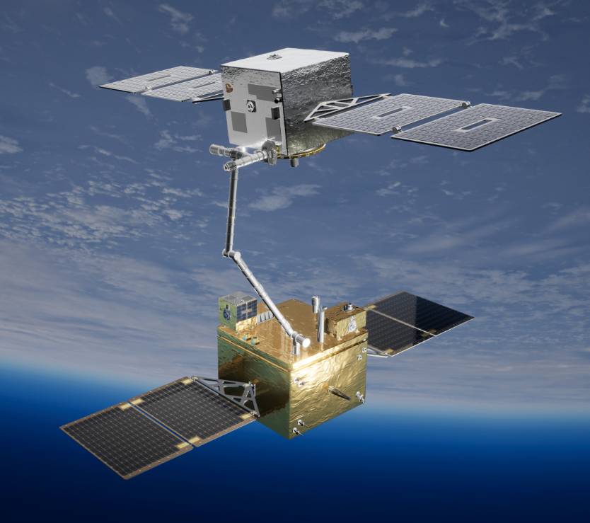 Rendering of two small satellites in space connected by a robotic arm, with Earth visible in the background.