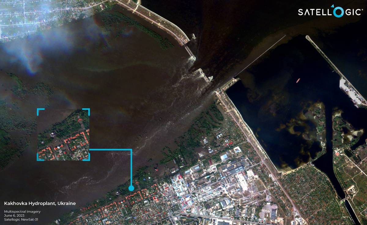 A high-resolution satellite image showing the destroyed Kakhovka Hydroelectric Power Plant in the Kherson region of Ukraine, with visible damage and surrounding areas affected by flooding.
