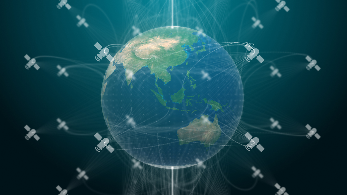 Earth surrounded by a network of satellites with connected lines, illustrating global satellite communication or a digital network concept.