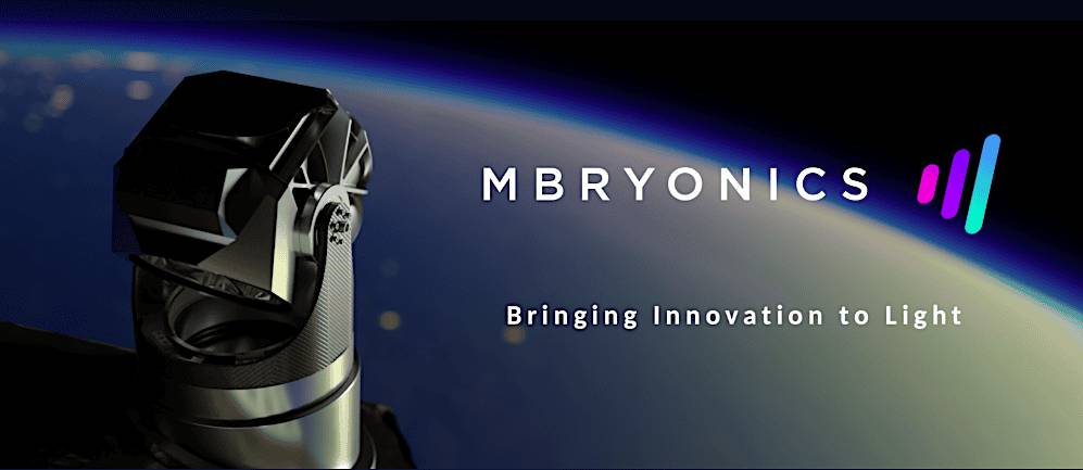 A high-tech optical device with the text 'MBRYONICS Bringing Innovation to Light' against a background of Earth viewed from space.