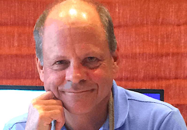 Close-up image of Gogo Chief Executive Oakleigh B. Thorne smiling, wearing a light blue shirt.