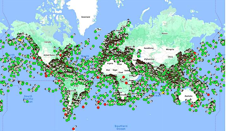 The image is a world map displaying the locations of customer vessels using maritime connectivity services, marked with green and red dots scattered across various oceans and coastal regions.