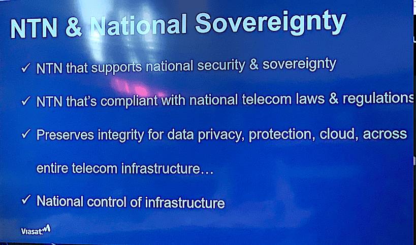 A slide titled 'NTN & National Sovereignty' with bullet points stating that NTN supports national security and sovereignty, complies with national telecom laws and regulations, preserves integrity for data privacy and protection across telecom infrastructure, and maintains national control of infrastructure, with a Viasat logo in the corner.