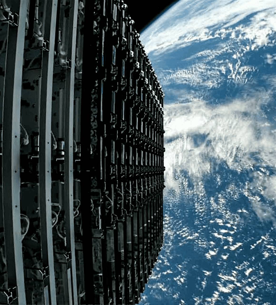 Close-up view of a stack of Starlink satellites in orbit with Earth’s surface and clouds visible in the background.